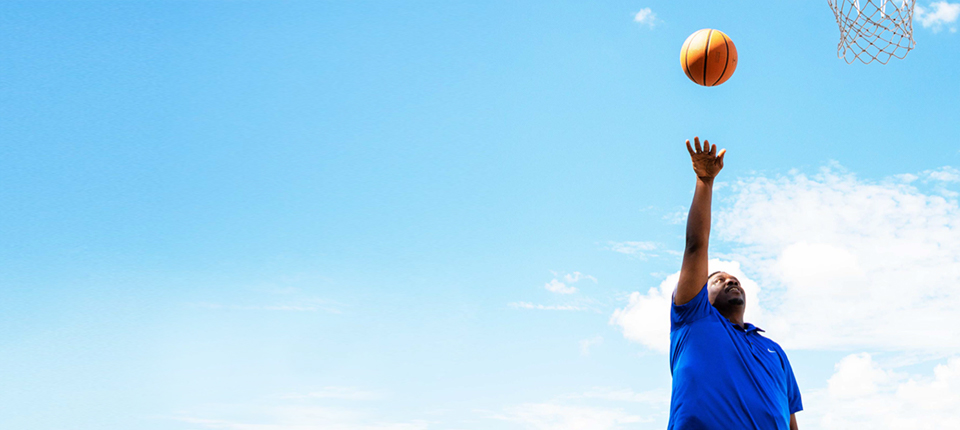 Person in blue shorts under blue sky during daytime