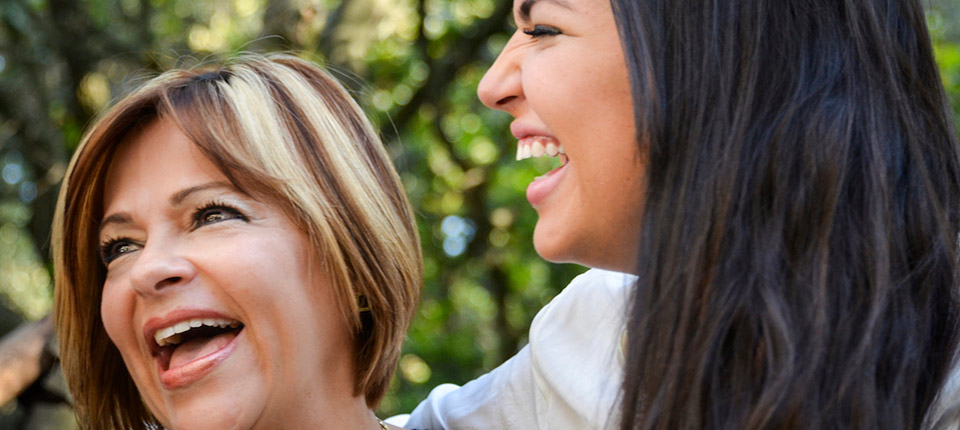 Cheerful mother and young daughter